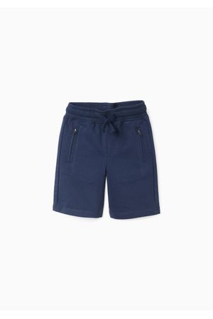 Bermuda jogger con bolsillos con cremallera